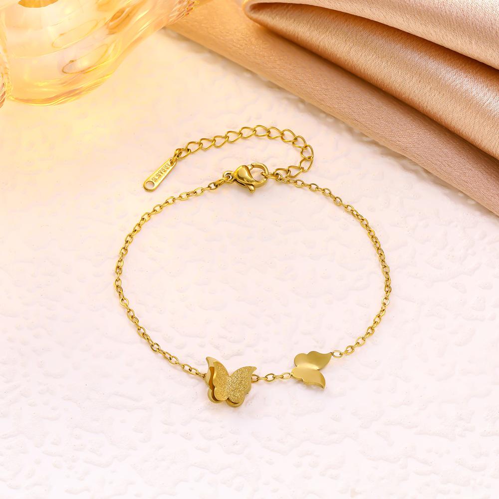 Trendy Titanium Steel Frosted Butterfly Jewelry Set: Double-Layer Necklace, Bracelet, Earrings, and Ring.