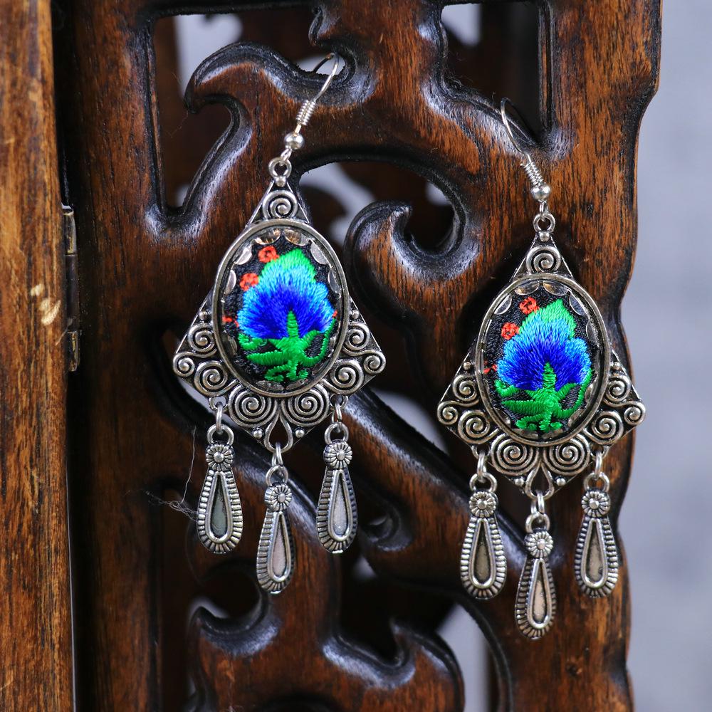 Chinese Retro Plum Blossom Fan Earrings: Women's Qipao Bell Tassel Pendants for Hanfu
