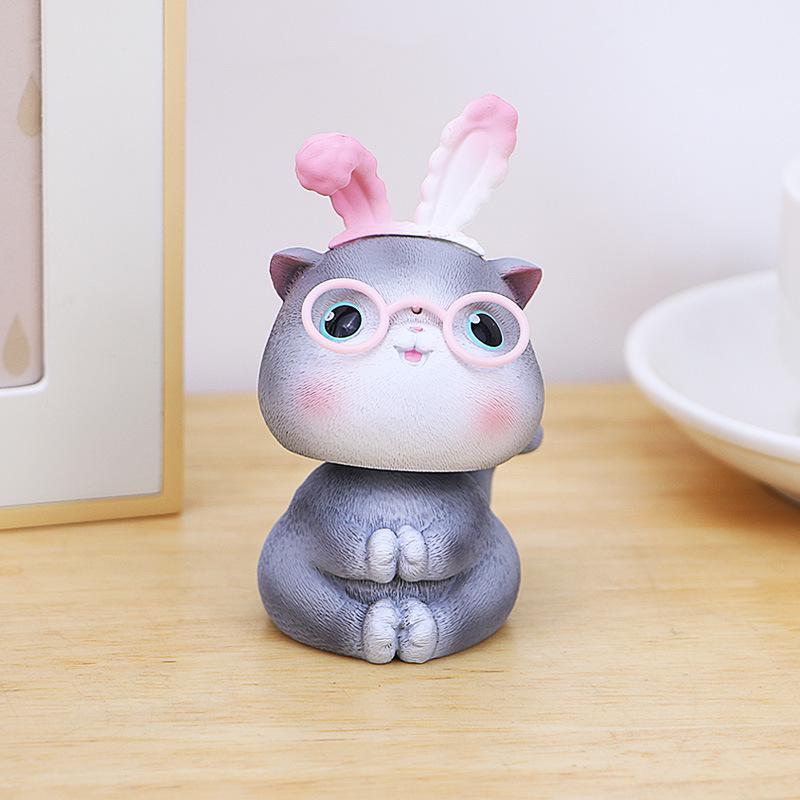 

Creative Cat Head Shaking Ornament for Office, Desktop, and Car Console Decoration As shown