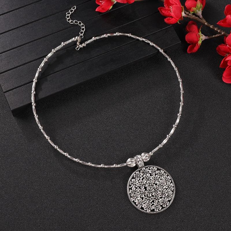 Vintage tassel collar hollow flower seedling silver pendant necklace niche personality collarbone chain women