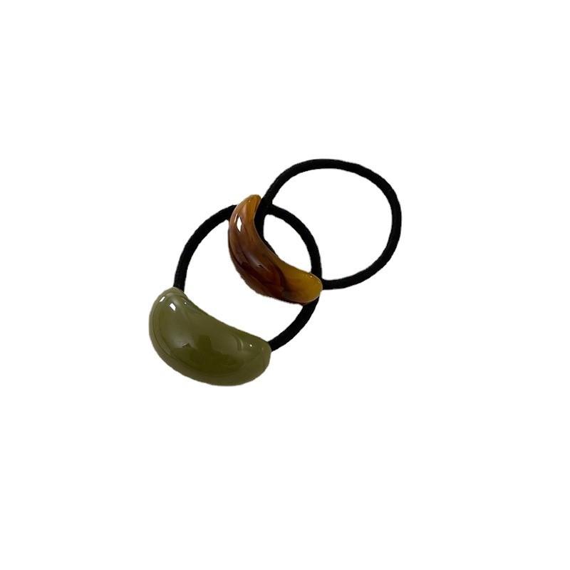 Ein schlichter und eleganter, kalter Stil Acryl-Bogenförmiger Lederband-Kopfschmuck für Damen