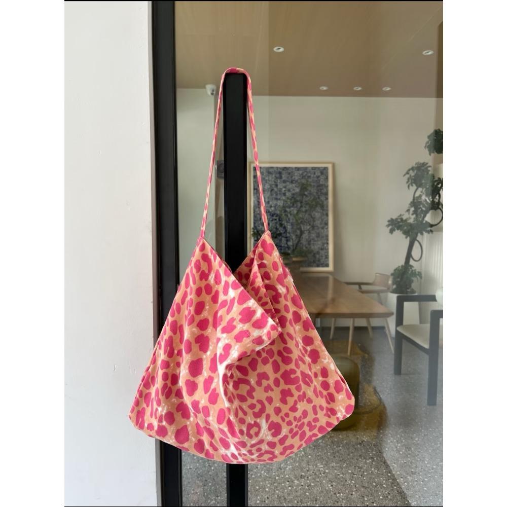 

Pink large-capacity leopard print canvas bag women 2025 new lazy wind commuter tote bag fashion shoulder messenger bag