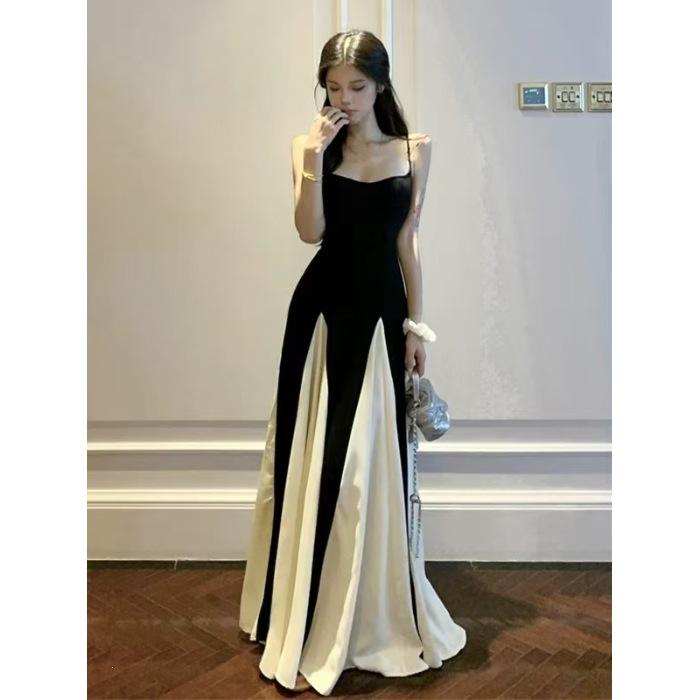 French high-end black and white splicing suspender dress Hepburn style beautiful unique temperament waist a word long dress summer