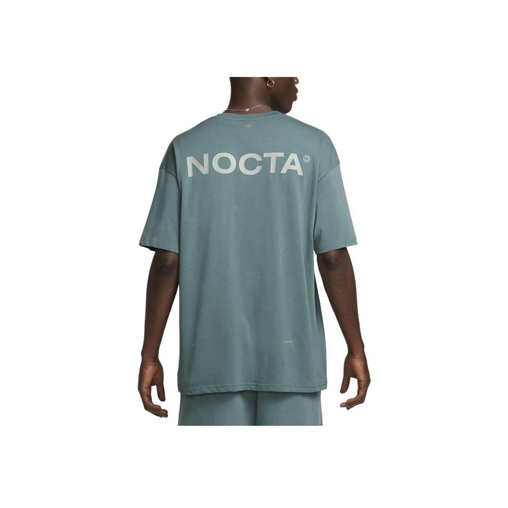 Nike X Nocta Big Body CS Άνετο Μπλουζάκι Κοντομάνικο με Γράμματα Unisex Τοπ ΜινERAL-Slate Ξεθωριασμένο-Έλατο Μικα-Πράσινο FN7663-382