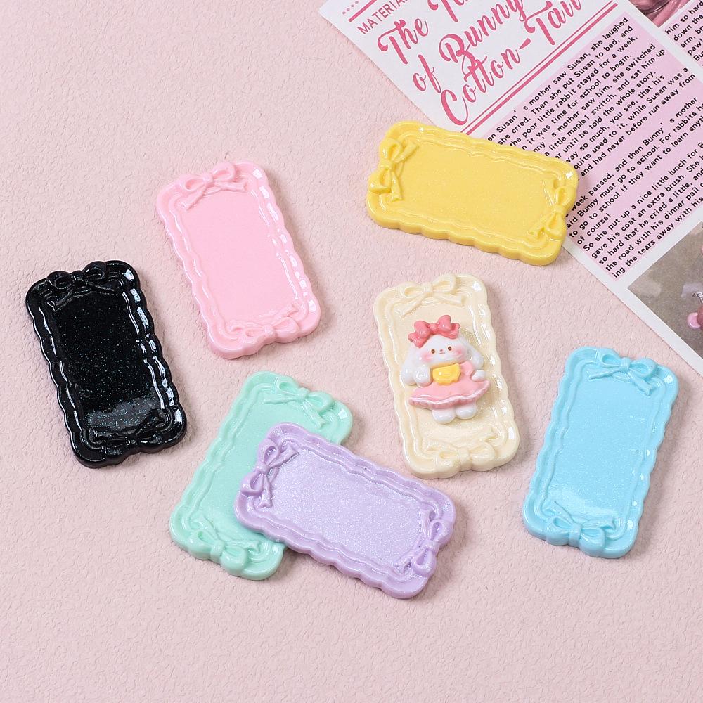 Tegneseriesløyfemønster harpiksplate for DIY hårnål og magnetlaging