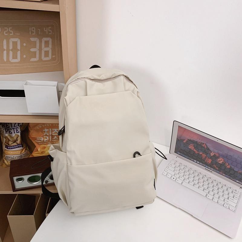 Schoolbag new large-capacity high-value junior high school student casual schoolbag Japanese and Korean version solid color fashionable simple