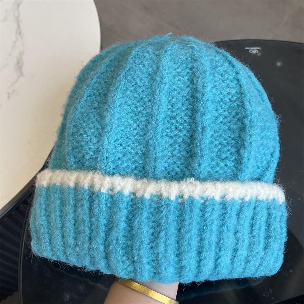 

Осень и зима новая модная однотонная универсальная вязаная шапка женская теплая защита ушей шерстяная шапка большой обхват головы показывает маленькое лицо Adult average size синий