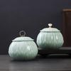 Celadon Ceramic Tea Canister: Large Half-Pound Capacity Storage for Green or Black Tea - Porcelain Sealing Jar with Printed Design.