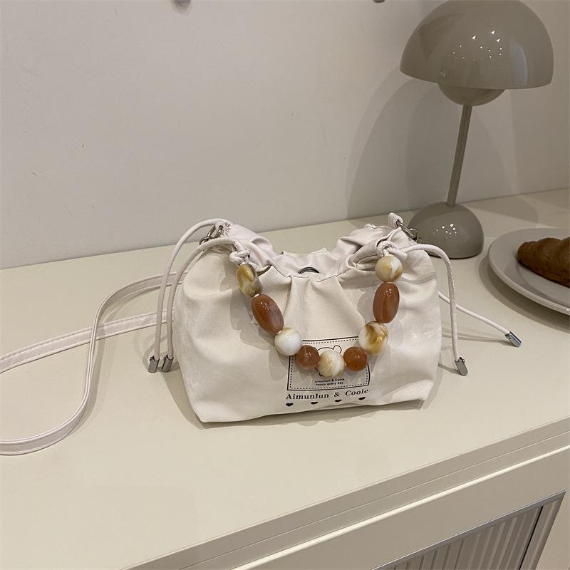 

Женская сумка сумка из бисера новая универсальная простая нишевая дорожная на плечо через плечо сумка-ведро белый