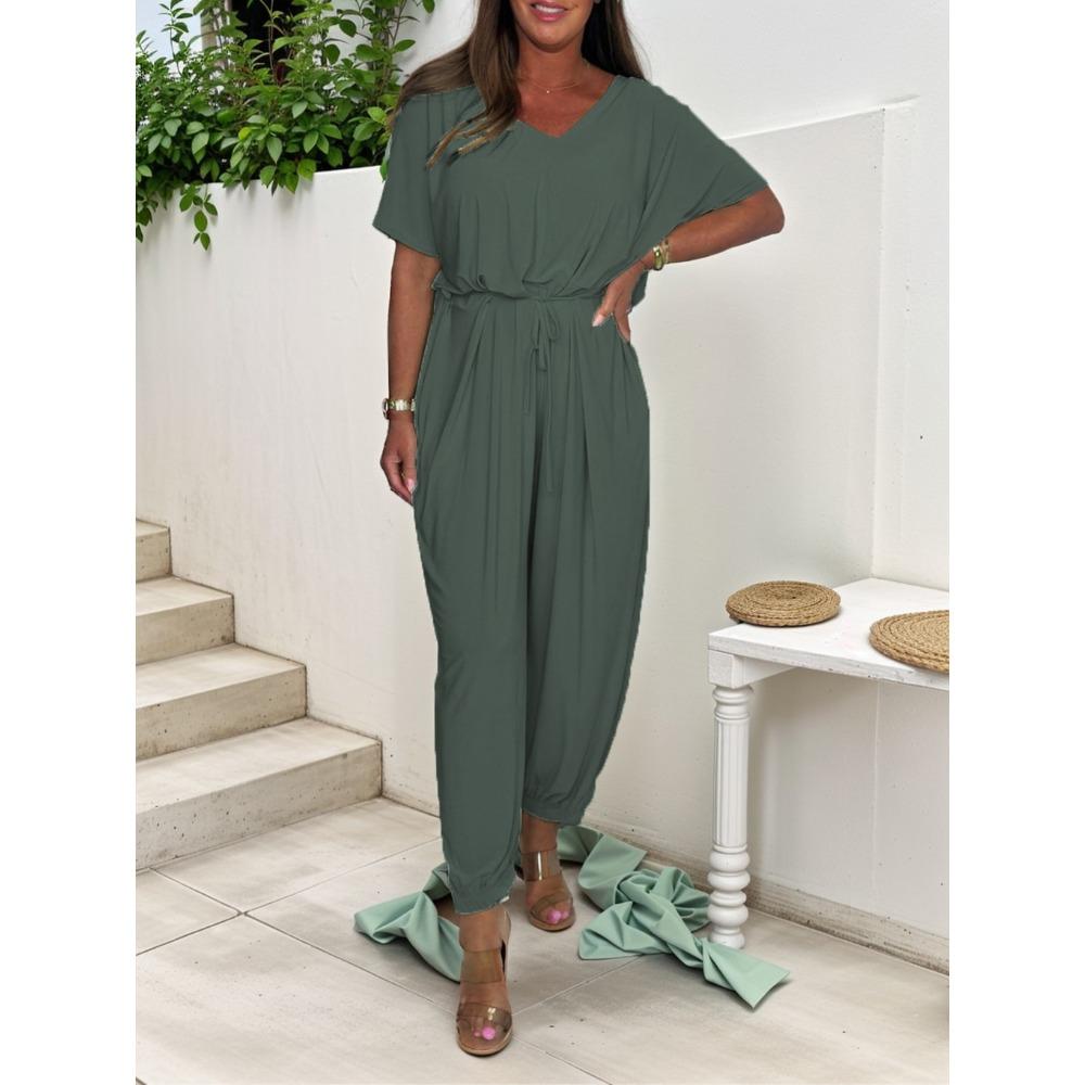 Dámský jednodílný overal s V výstřihem a stahovací pasem, jednobarevný, ležérní, volný, s krátkým rukávem