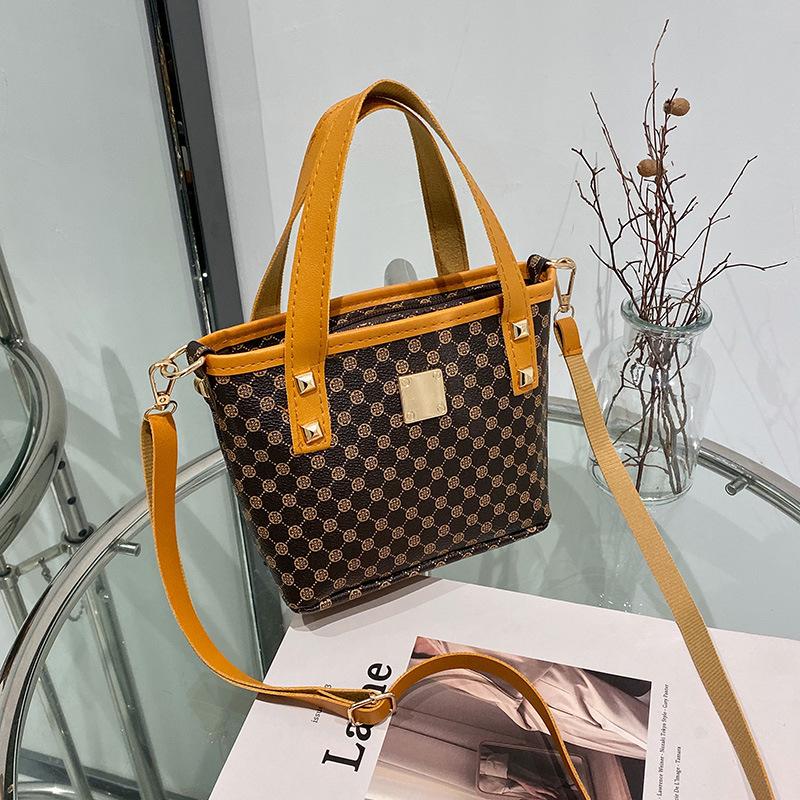 Women's bag, new spring and summer temperament, retro oblique span bucket bag, a portable underlay flower bucket