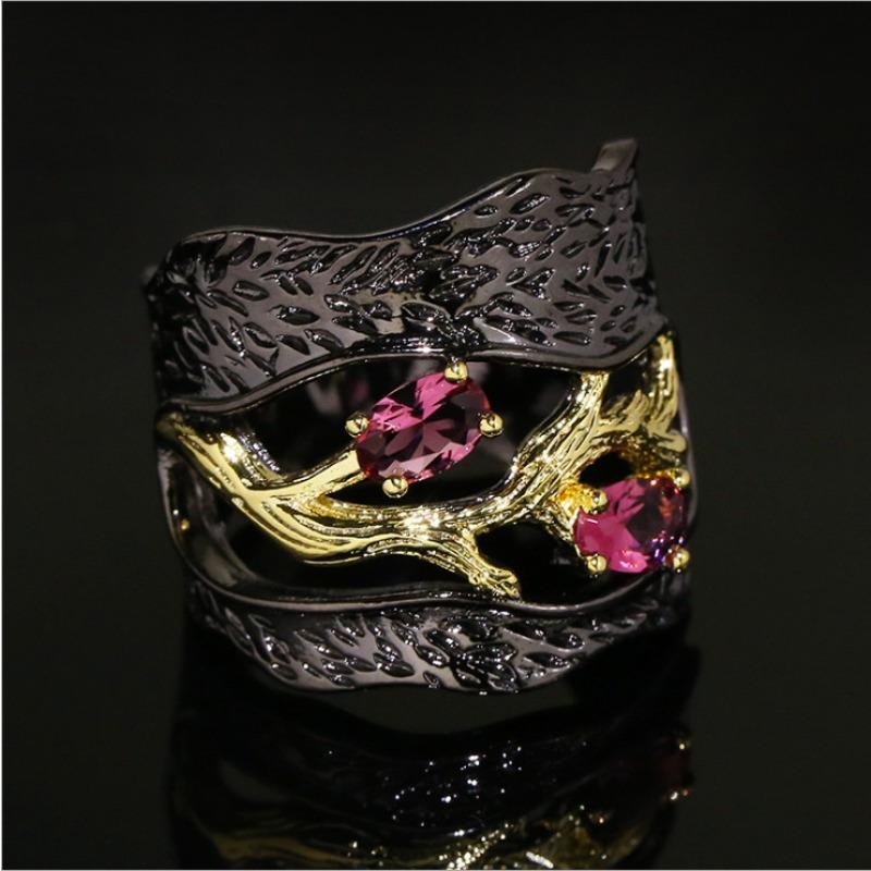 Black and gold branch ring with inlaid accents. Unique art style for Halloween and Christmas—mysterious and fantastical.