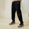 Li Ning Solid Color Loose Fit Embroidered Cuffed Knitted Sports Pants Men Bottoms Black AKLT611-3