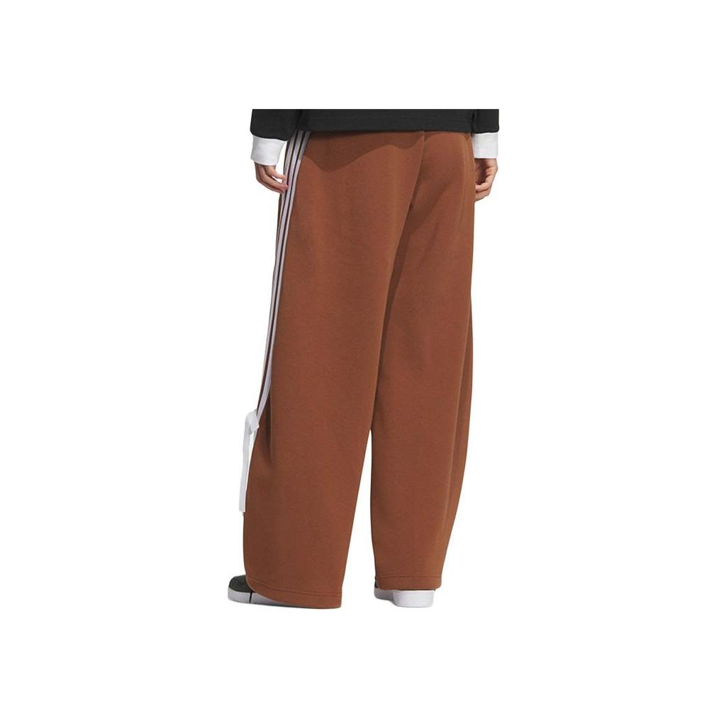 adidas Spodnie damskie luźne casualowe w paski z logo marki z kokardą KG3856