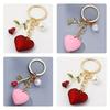1 Romantic Rose Heart Keychain for Men - Stylish Golden-Tone with Red or Pink Heart Charm, Elegant Accessory for Keys and Bags
