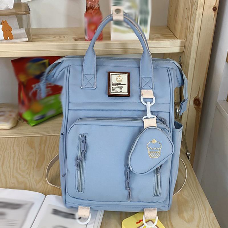 

2025 Новый японский литературный рюкзак Большой вместимости Легкий Водонепроницаемый Защита спины Школьный ранец Однотонный Повседневный Портативный рюкзак синий