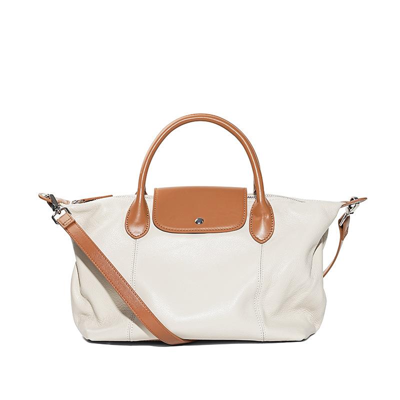 The first layer of cowhide fashion dumpling bag, versatile leather high-end color contrast large-capacity handbag women