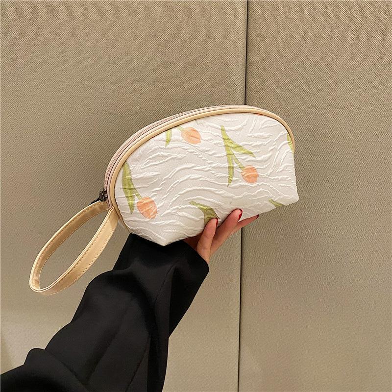 2026New half-moon-shaped floral hand-held cosmetic bag, portable makeup organizer, cute and unique, perfect as a small pouch or pencil case