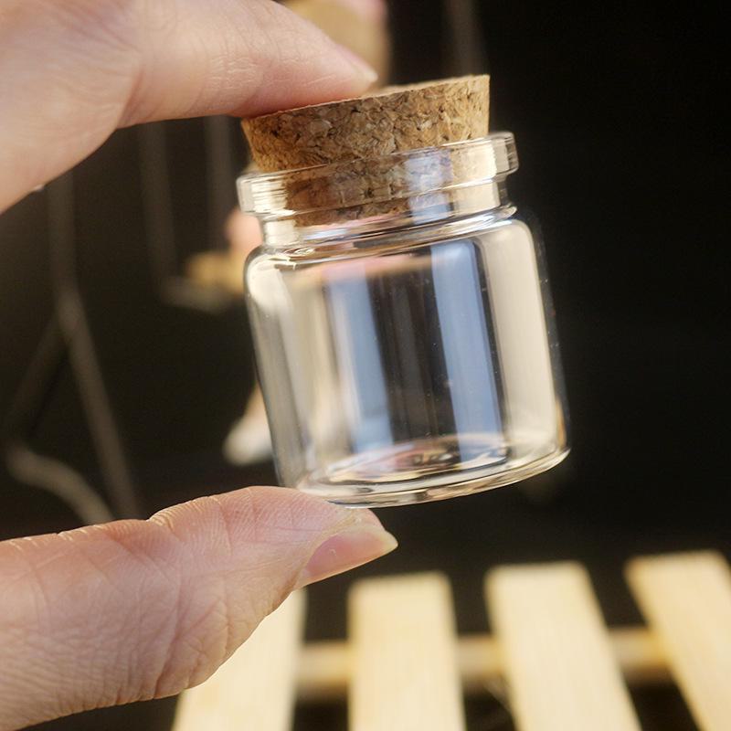 Botella de vidrio transparente de 15 ml con tapa y tapón de madera, cuentas de burbujas y capacidad de 20 ml.