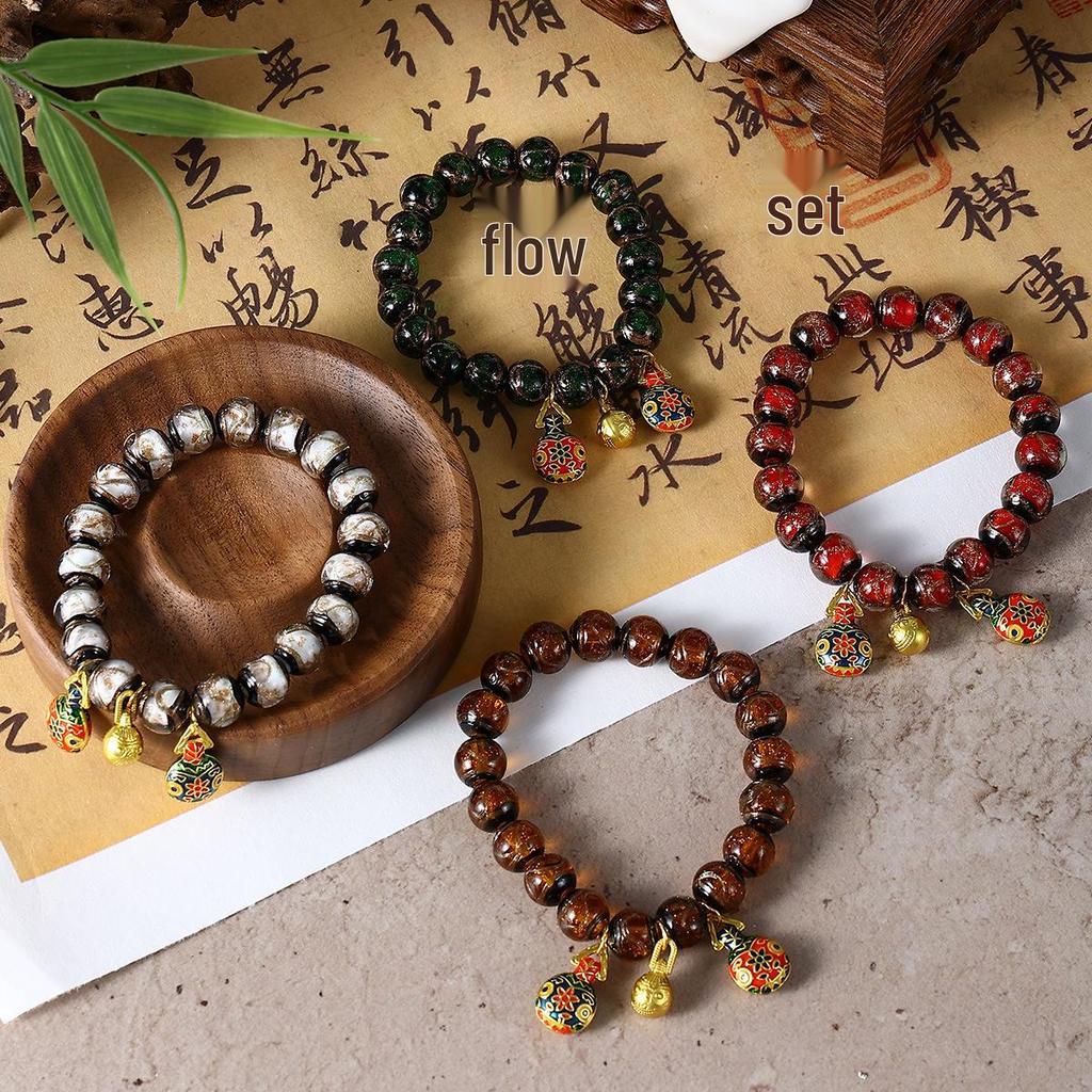 Aschgraues Pi Xiu Glasperlenarmband mit Blattgold und bunten Perlen