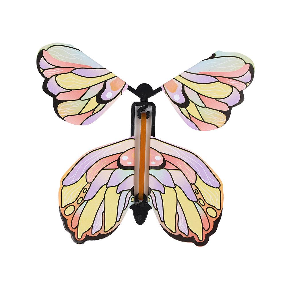 

1Pcs Magic Wind Up Flying Butterfly in The Book Rubber Band Powered Magic Fairy Flying Toy Great Surpris Gift Party Favor