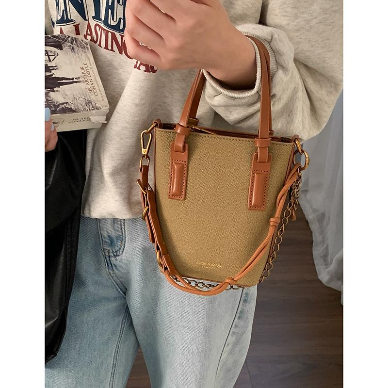 

Retro casual canvas handbag small bag 2025 new simple bucket bag versatile shoulder messenger mobile phone bag коричневый