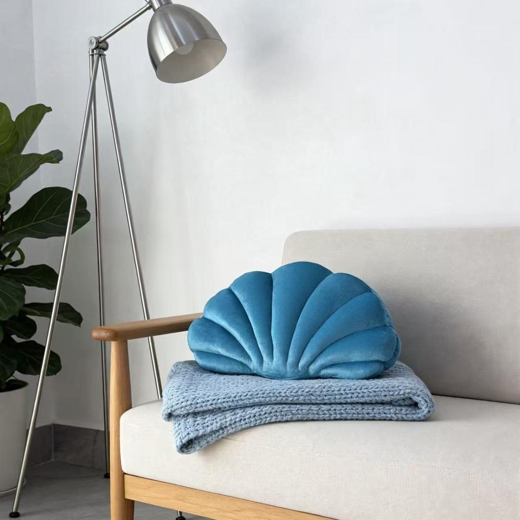 A seashell-shaped pillow, suitable for living room sofas, bedrooms, offices, and home decor.