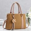 Simple commuting classic flower tassel decorative handbag new gentle temperament crossbody shoulder