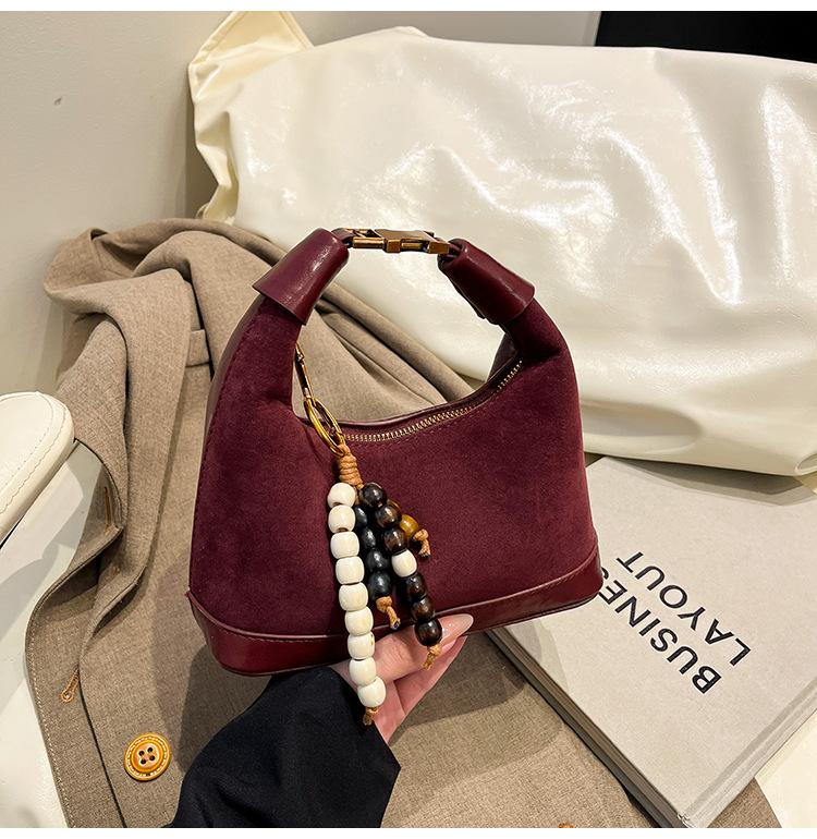 

Популярные в этом году женские сумки высокого класса в стиле ретро 2025 новый нишевый дизайн портативная на плечо через плечо для поездок на работу сумки-пельмени красный