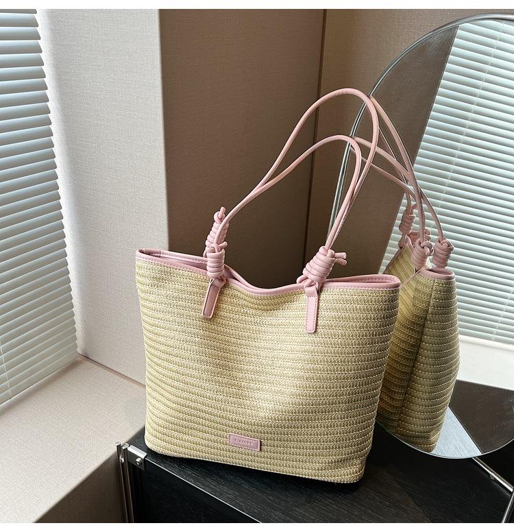 

2025 лето простая и универсальная пляжная сумка повседневная сумка через плечо премиальная текстура плетеная из соломы сумка-тоут розовый