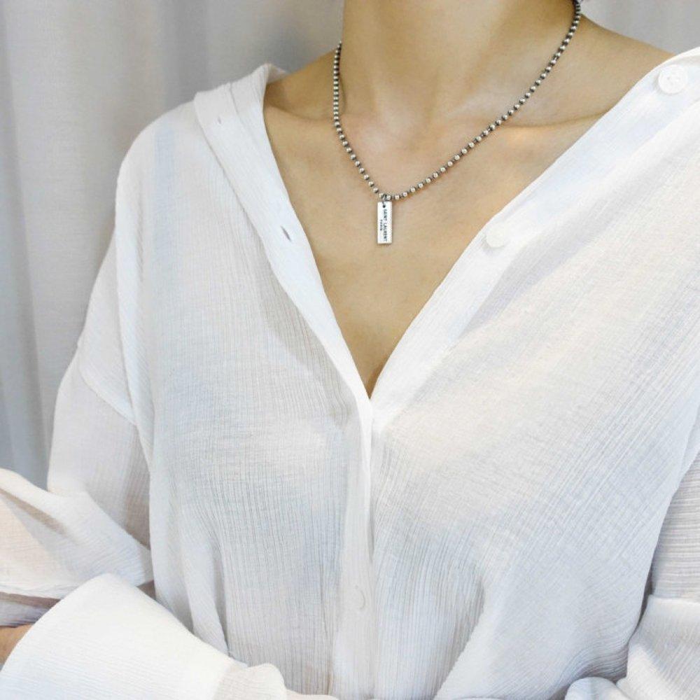 Jyoni / Yuhwa's silver dog tag necklace