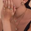 Oumika Oumei Five-Petal Zircon 360° Rotating Jewelry Set: 18K Gold-Plated Earrings, Ring, and Necklace.