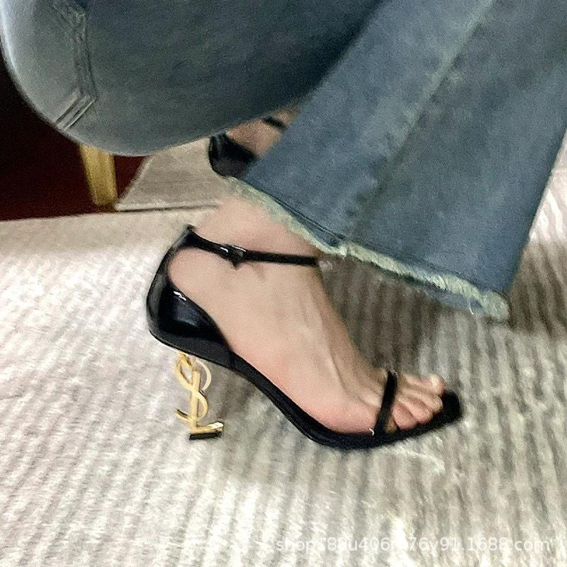 

[Spot] One-word sandals women s 2025 summer new sexy versatile letter buckle open-toed black stiletto shoes 40