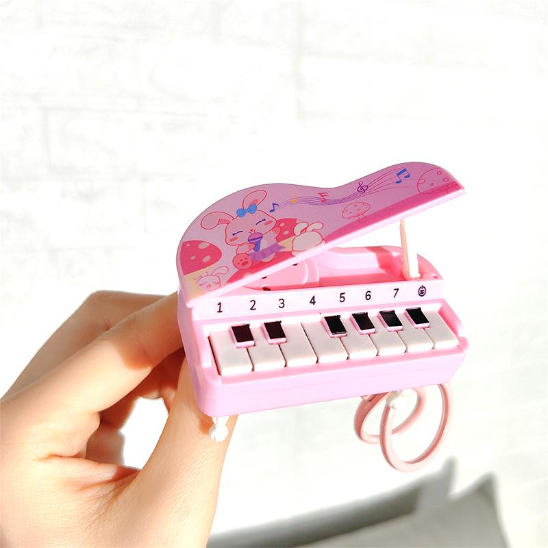 

Luminous Mini Piano Keychain - Cute Musical Stress Relief Pendant розовый