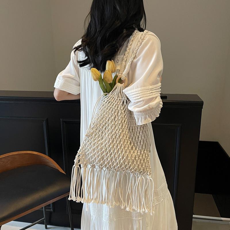 Women's Bag Large-capacity New Summer Leisure Shoulder Shopping Bag Hollow Tassel Woven Bag Bucket Bag