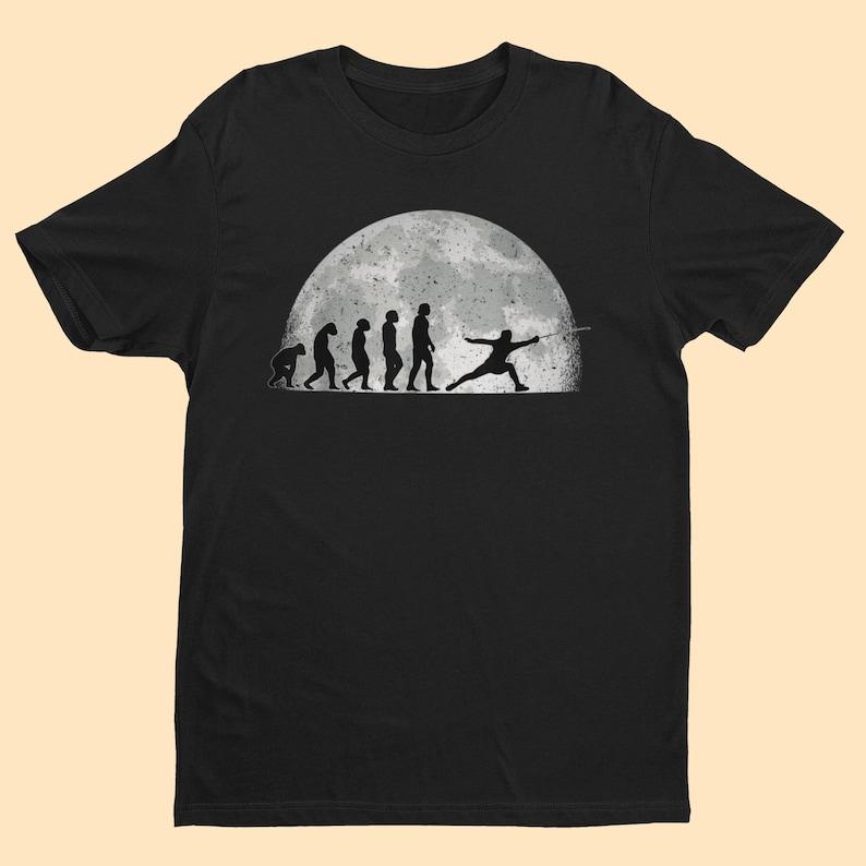 Evolution of The Sword Fencer T Shirt From Ape Through Prehistoric Man To Fencer Fencing In The Moonlight Graphic T Shirts Tees