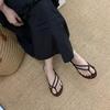 Korean Niche Beach Vacation Flat-bottomed Toe Flip-flops Women's Outer Wear 2025 Summer New Woven Cool Slippers