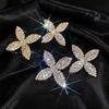 European & American Luxury Rhinestone Clover Stud Earrings - Elegant Silver Needle Design for Women
