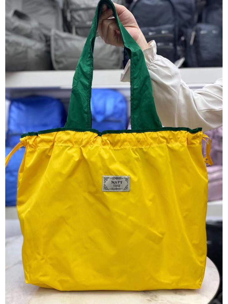 Eco-friendly Lightweight Water-repellent Foldable Shopping Bag with Drawstring Closure and Large Capacity