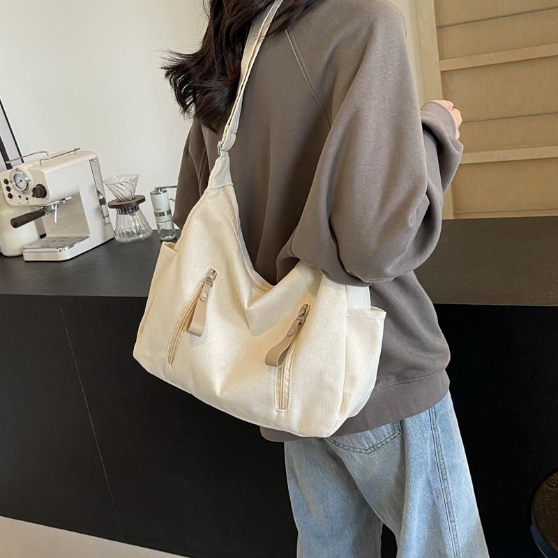 Shoulder bag women's large capacity 2025 new solid color versatile Korean version casual large capacity messenger bag canvas dumpling bag