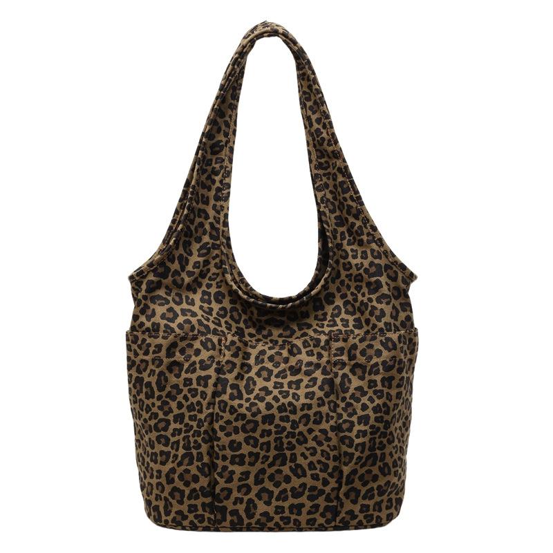 This season, Korean ins style leopard print canvas bag casual large capacity commuter women's shoulder underarm triangle tote bag