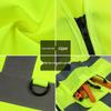 Přizpůsobitelná fluorescenční bezpečnostní vesta s více kapsami a reflexními pruhy pro noční stavební práce