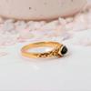 Black Onyx Marquise Gold Ring: Elegant vintage-style jewelry with a dark navette gemstone and ornate filigree band.
