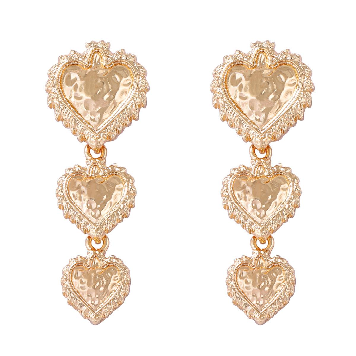 

European and American retro, simple and cold style alloy concave-convex hammer texture texture heart-shaped splicing earrings for women