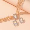 Luxuriöse doppellagige geometrische Kristallkette und rechteckiges Ohrstecker-Set