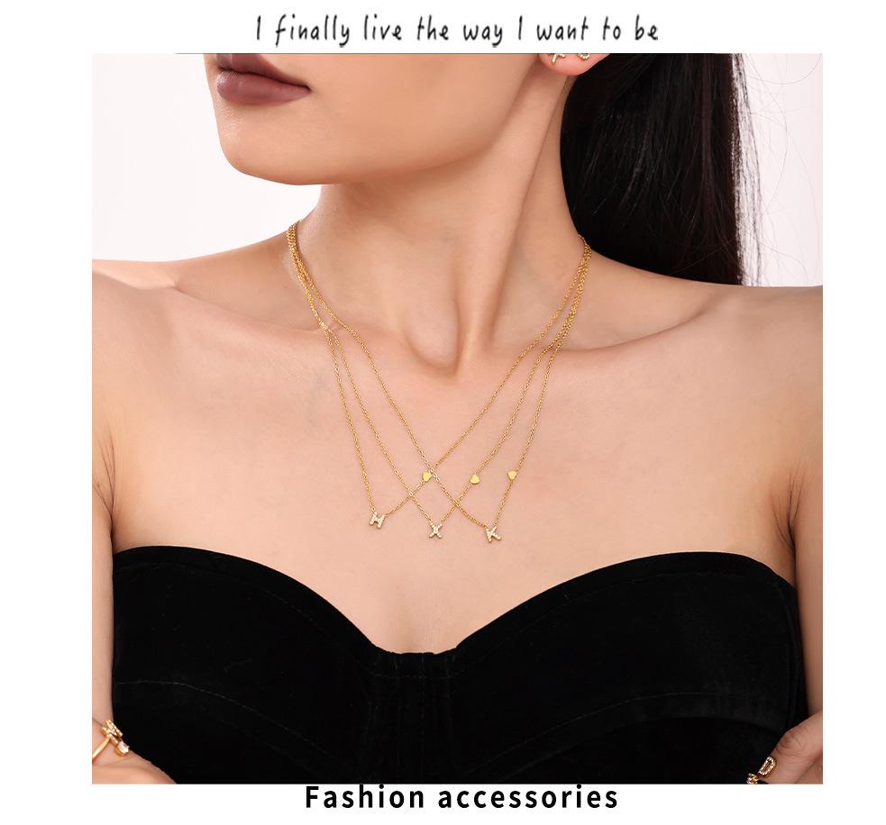 Oumeika Titanium Steel Jewelry Set: 26 Zircon-Inlaid Letters, PVD Gold-Plated Necklace, Bracelet, Earrings, and Ring.