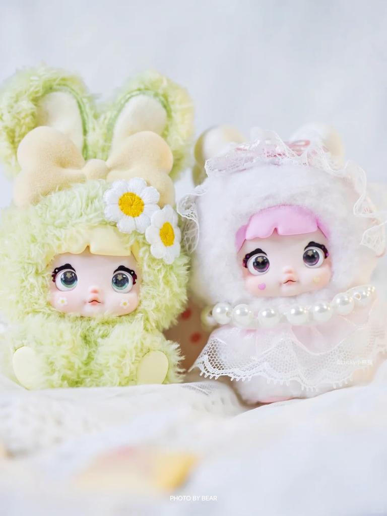 Nommi Plush Mascot Keychain Blind Box Fluffy Exterior Rigid Interior for Standing Includes 3 Rotating Perfect as a Bag Charm or Tabletop Decor 8 Types
