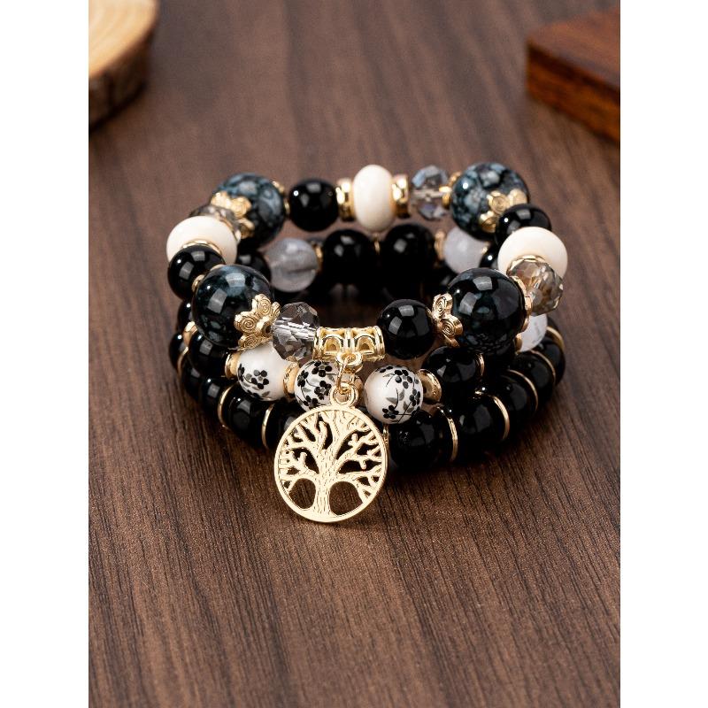 

Браслет «Полое Древо Жизни» Браслет с подвеской из сине-белого фарфора и стеклянных бусин с узором чёрный