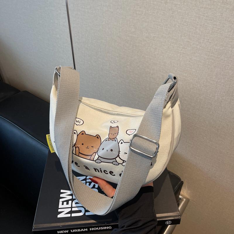 

Niche design canvas dumpling bag women s new cartoon printed shoulder bag versatile messenger bag серый