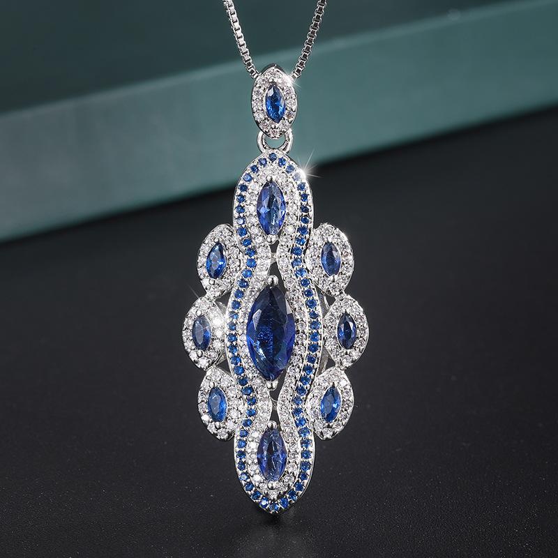 

Ювелирные изделия Медь Позолоченные Ювелирные изделия Имитация Синее Стекло Ручной работы Бриллиант Женский Костюм Главный Камень 5 * 9